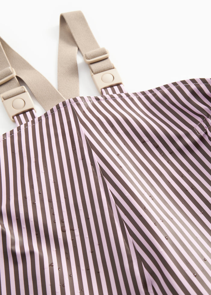 Rain jacket in pink/brown stripes with beige trim details and snap button closure.