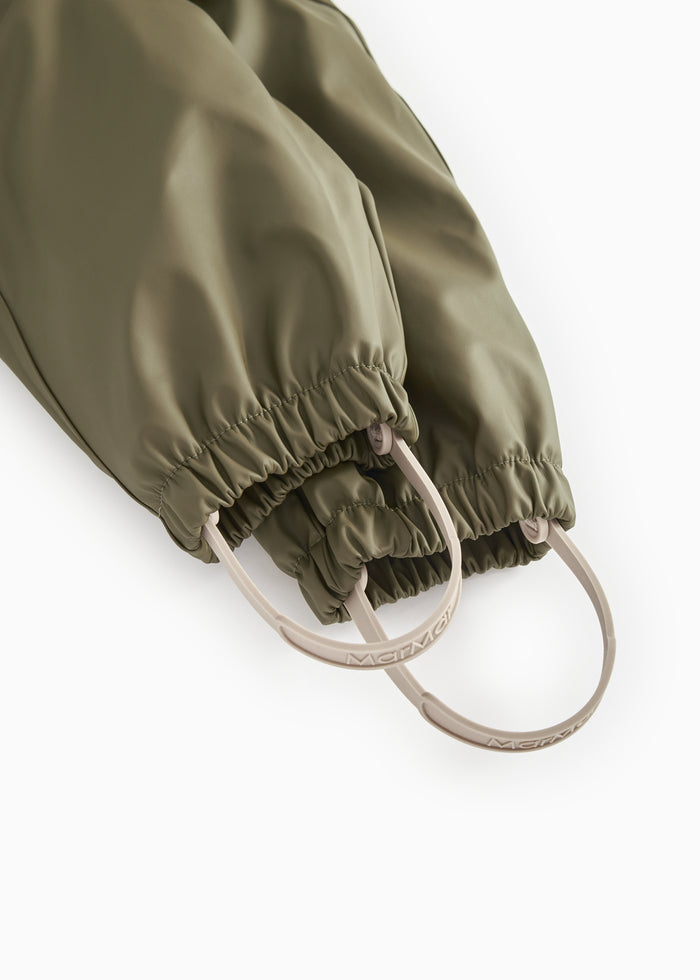 Olive green baby raincoat with elastic at the ankles and drawstring at the opening.