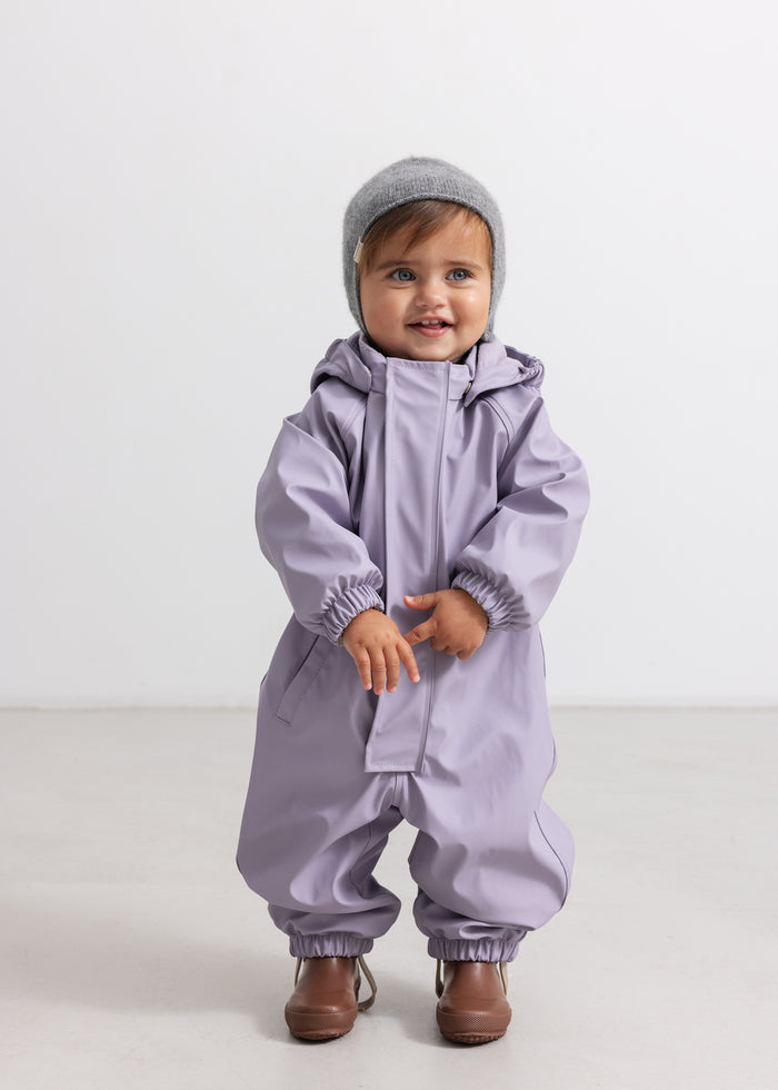 Lavender raincoat with hood and zipper, worn by a child.