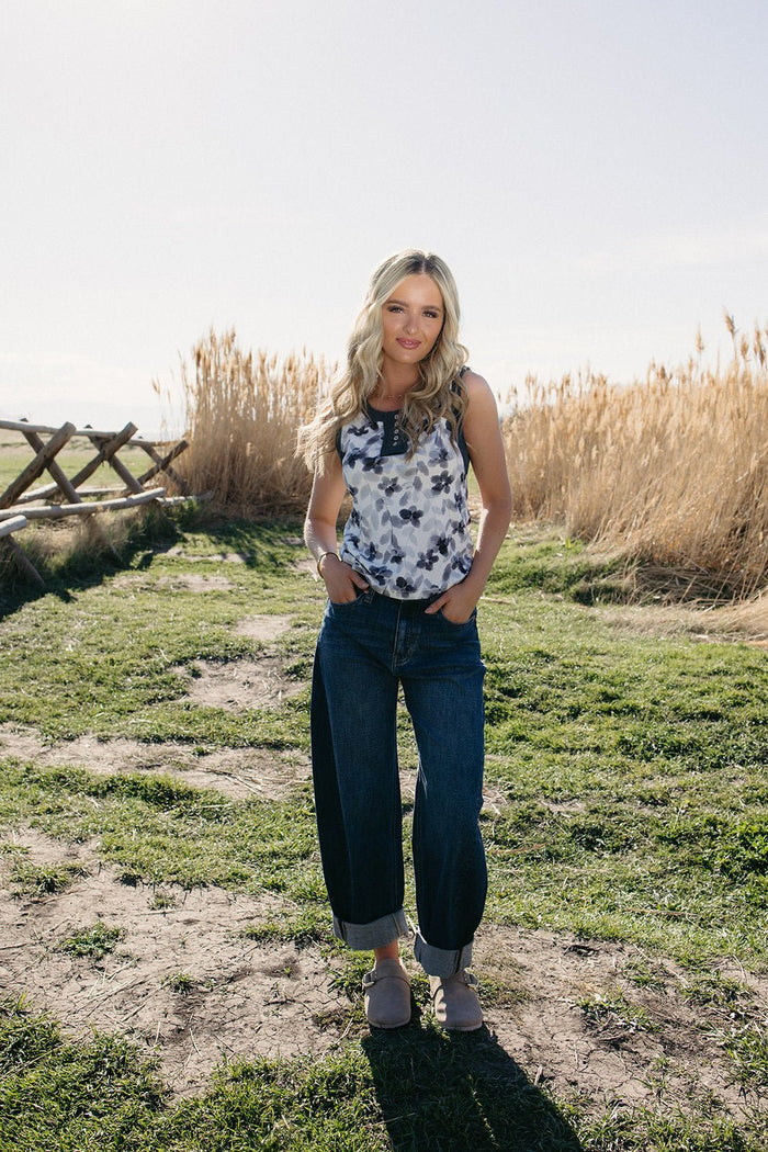 High rise relaxed barrel jeans with a tapered ankle and dark stone wash, perfect for trendy everyday outfits and western styling.