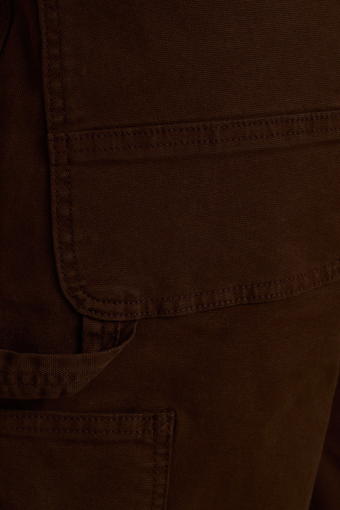 Close-up of mocha brown cargo short cotton canvas with topstitched flap pocket detail.