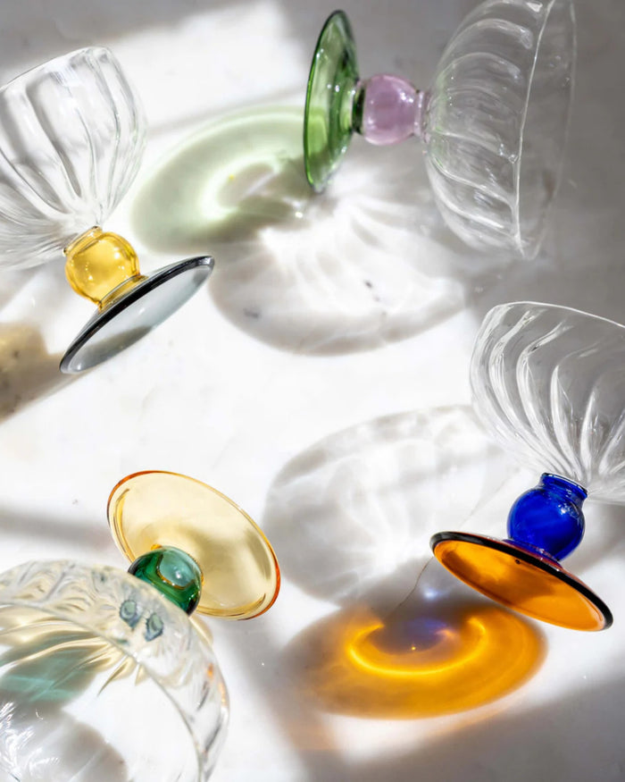 Set of clear glass dessert bowls with colored pedestal bases