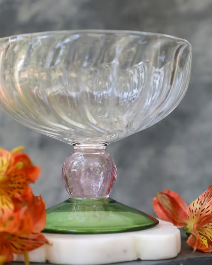 Clear glass dessert bowl on green pedestal stand, ready for serving