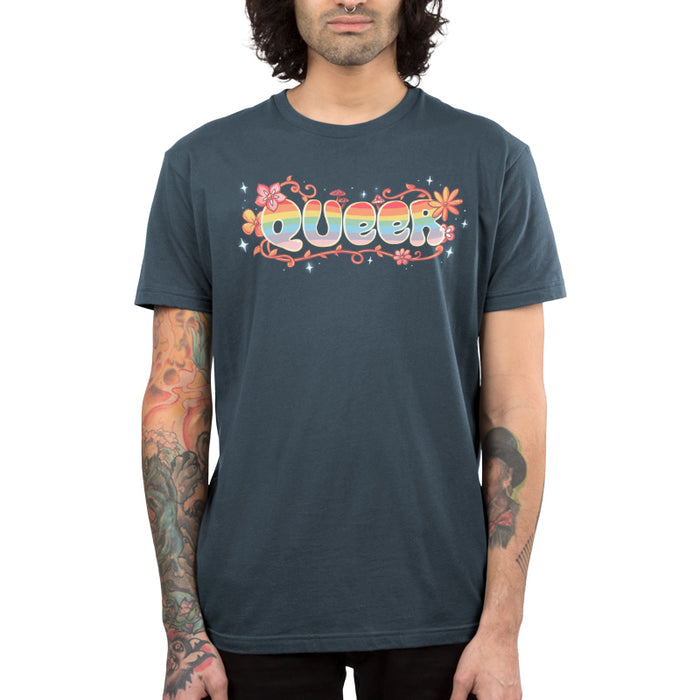 Premium Cotton T-shirt_TeeTurtle denim blue Queer apparel featuring an artistic "queer" word filled with rainbows and surrounded by flowers, vines, and mushrooms.