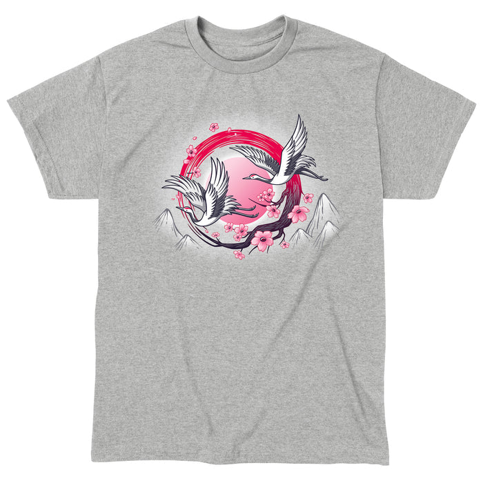 Classic Cotton T-shirt_TeeTurtle Red-Crowned Cranes heather gray t-shirt featuring an illustration of two cranes in flight with pink sakura blossoms, a red circular element, and stylized mountains in the background.