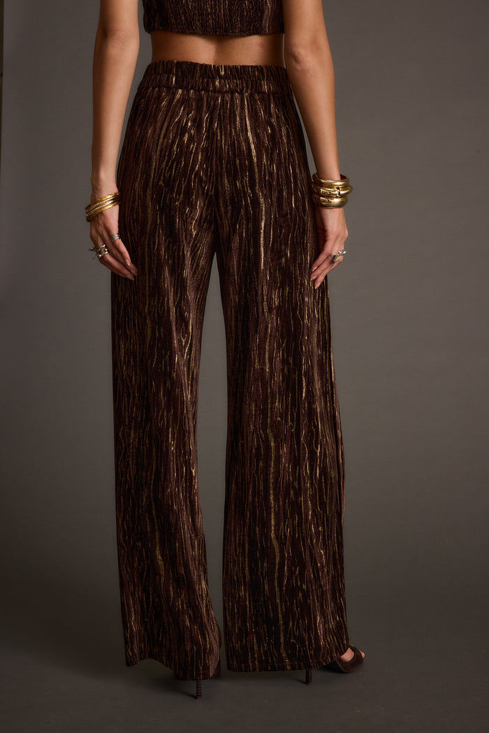 Rhea Espresso Velvet Trousers paired with complementary accessories for a polished look.