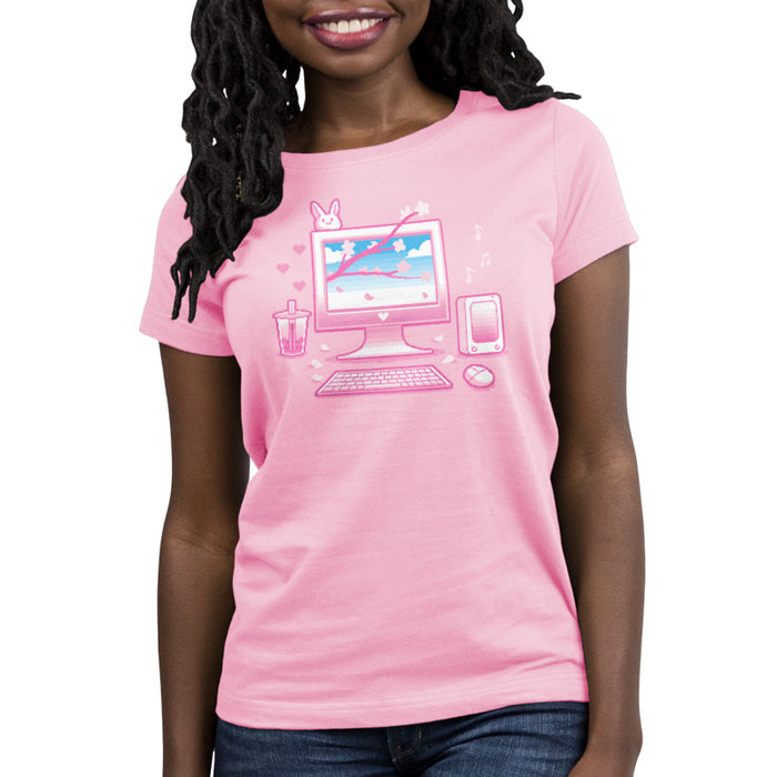 Premium Cotton T-shirt_TeeTurtle Sakura Setup light pink t-shirt featuring pixel art of a desktop computer setup in pink hues. The screen displays cherry blossoms and blue sky. A bubble tea, bunny, and musical notes adorn the scene. A keyboard and mouse are positioned below.