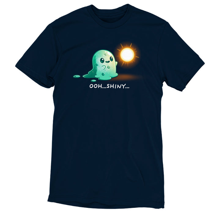 Premium Cotton T-shirt_TeeTurtle Shiny Distraction navy blue t-shirt featuring a slime creature staring in awe at a glowing, golden orb.