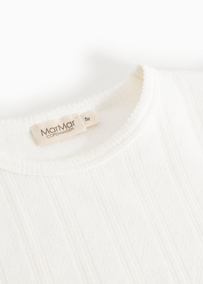White nightdress: round neckline and MarMar Copenhagen tag at the neck.