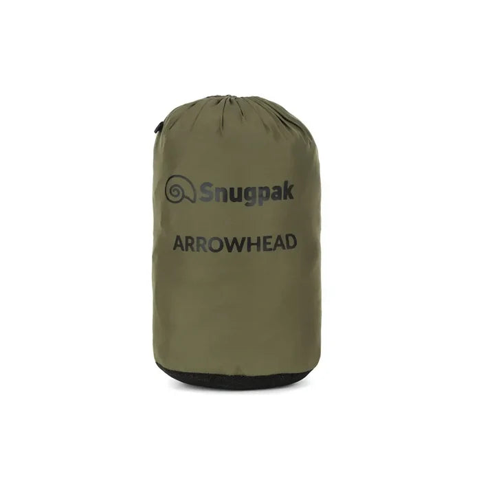 Snugpak Arrowhead insulated windproof jacket in olive packed in to its stuff sack on a white background