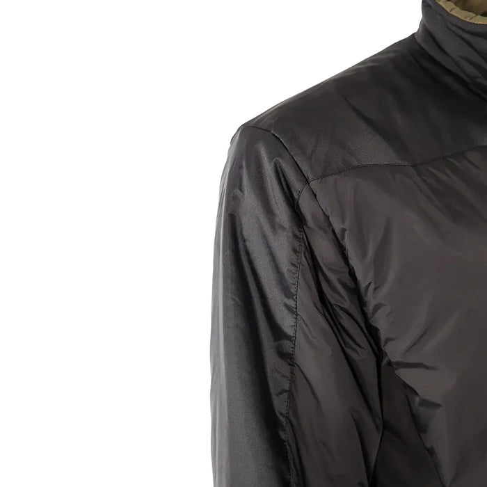 Shoulder detail shot of Snugpak Sleeka Elite Reversible insulated windproof jacket in black/olive