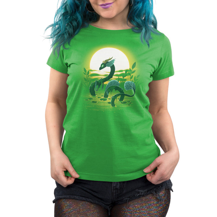 Premium Cotton T-shirt_TeeTurtle Swamp Dragon apple apparel featuring a magical dragon coming up out of a swamp covered in greenery with a sun setting in the background.