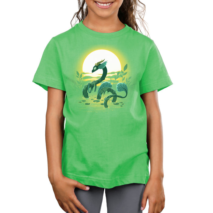 Premium Cotton T-shirt_TeeTurtle Swamp Dragon apple apparel featuring a magical dragon coming up out of a swamp covered in greenery with a sun setting in the background.