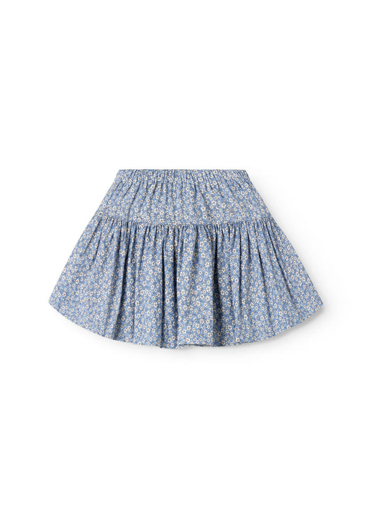 Blue skirt with elastic waist and flowing A-line, small white flowers.