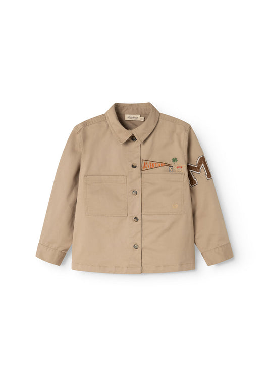 Beige children's jacket with reversible collar, buttons, and chest pockets.