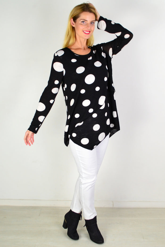 White spot crossover swing tunic top by Caroline Morgan displayed on a hanger, showcasing its stylish design and relaxed fit.