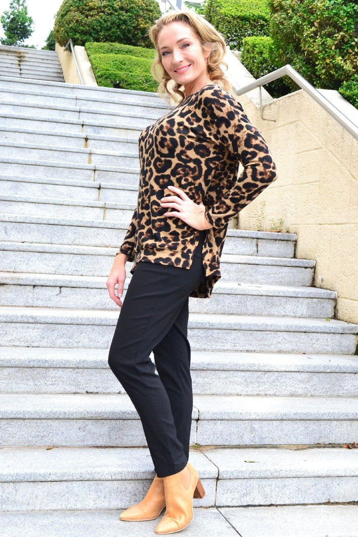 Caroline Morgan Wild Side Drop Shoulder Fleece Tunic Top with relaxed fit and cozy fleece fabric, shown on a hanger.