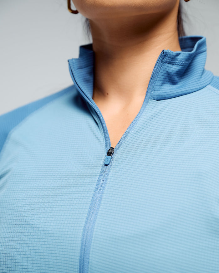 b1173_nwy_womens_kmd_action_quarter_zip_baselayer_top_d_1768348917000